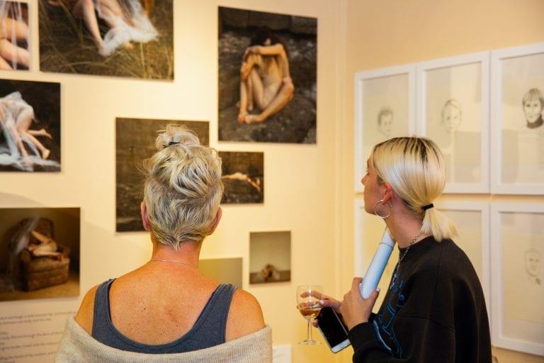 women viewing art work