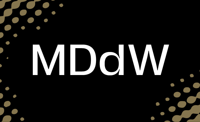 Black and gold banner with the white text "MDdW" in the centre.