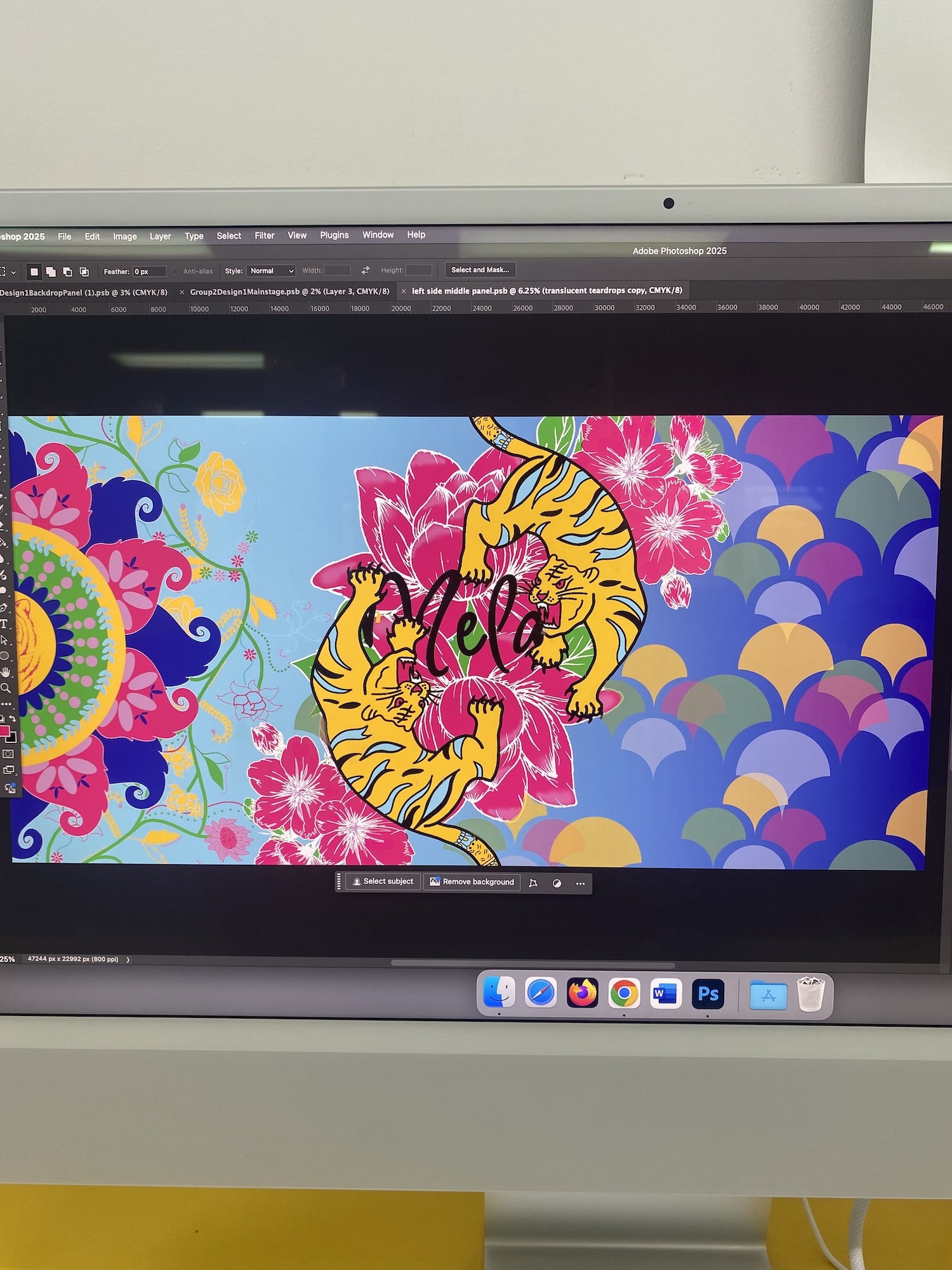 Computer monitor displaying colourful digital artwork with yellow tiger, pink flowers, blue swirls, and overlapping circular patterns in vibrant hues.