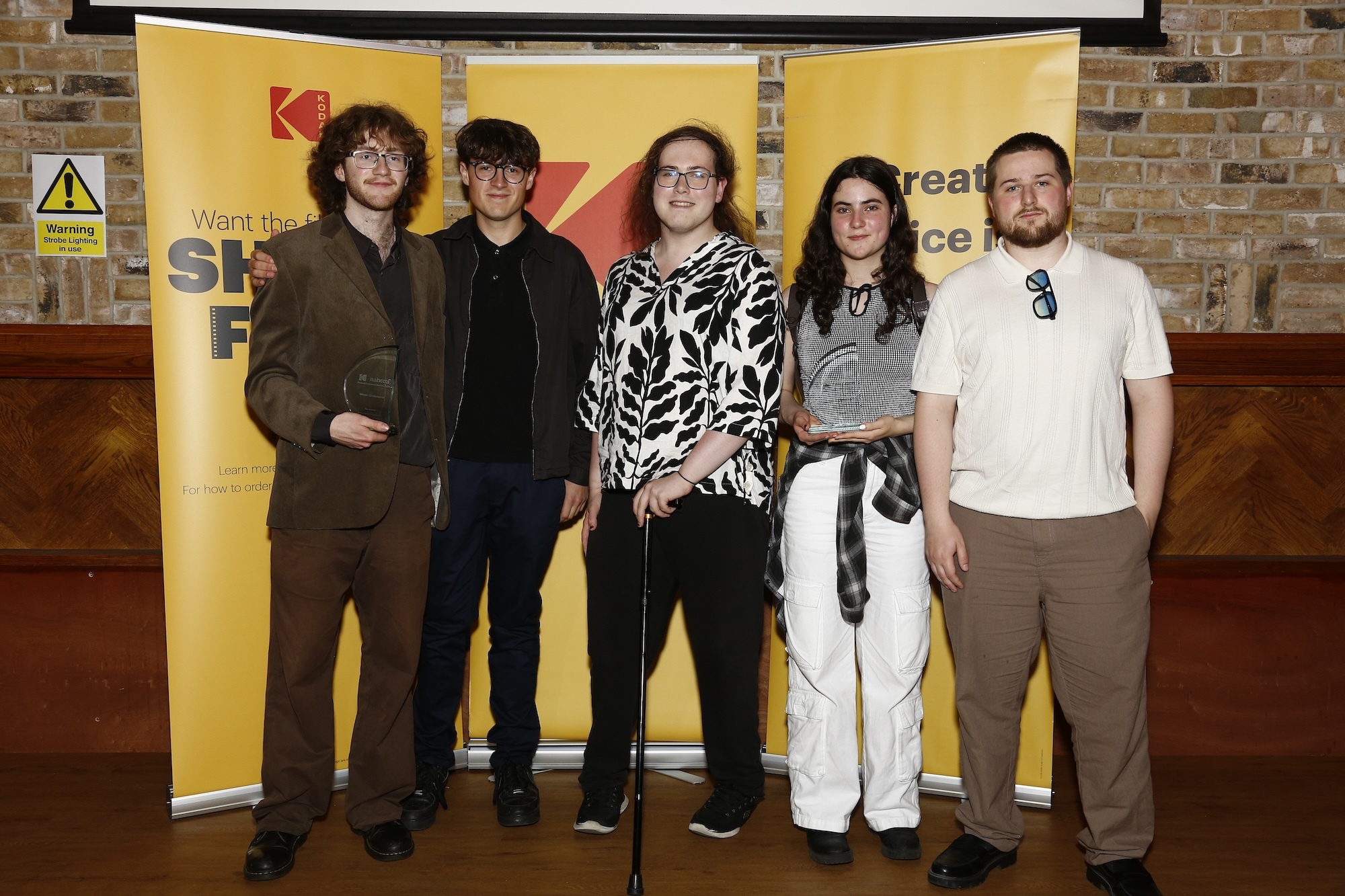 Five BA (Hons) Film Production students from Arts University Bournemouth pose for a photo at the Kodak/NAHEMI Student Commercial Awards.