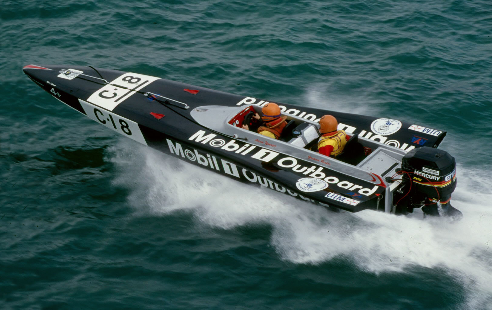 A boat powering through the water
