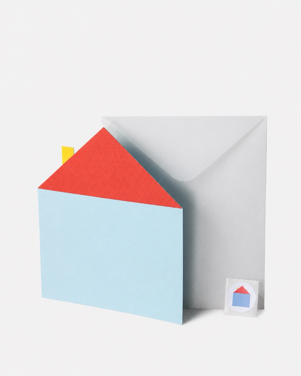 An open light blue envelope with a red insert in front of a larger grey envelope, with a small matching envelope icon beside it.
