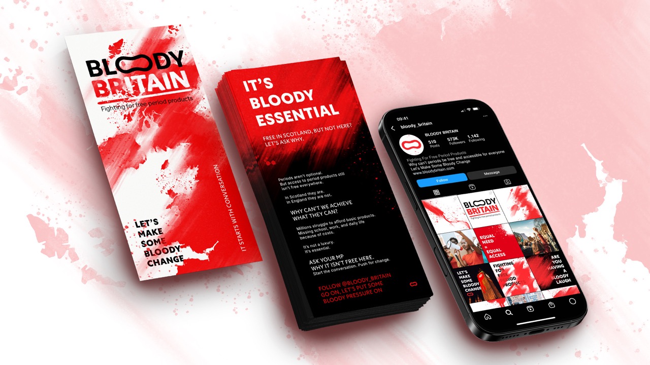 A promotional pamphlet titled 'Bloody Britain' featuring bold red and white graphics, alongside a smartphone displaying the campaign's social media page. The pamphlet emphasises 'It's Bloody Essential' and includes a call to action for making change.