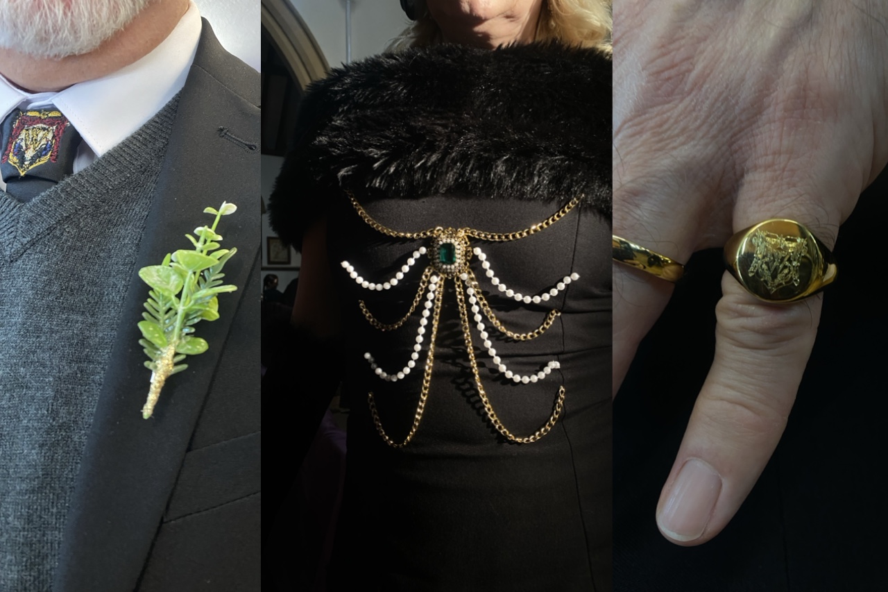 A collage featuring three close-up views: a man in a dark suit with a green boutonnière, a woman in a black dress adorned with a pearl and gold chain design, and a hand displaying a gold ring with a lion emblem.