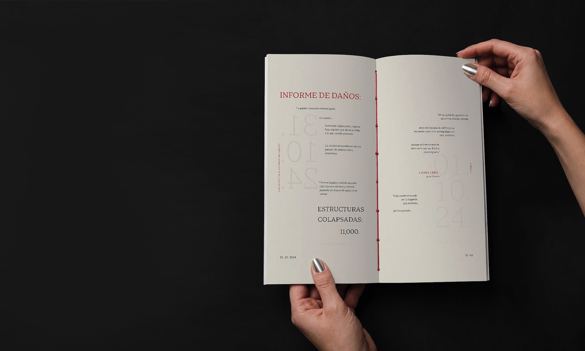 Hands holding open a book titled “Informe de Danos” on a black background, showing a two-page interior spread with pale text and diagrams.