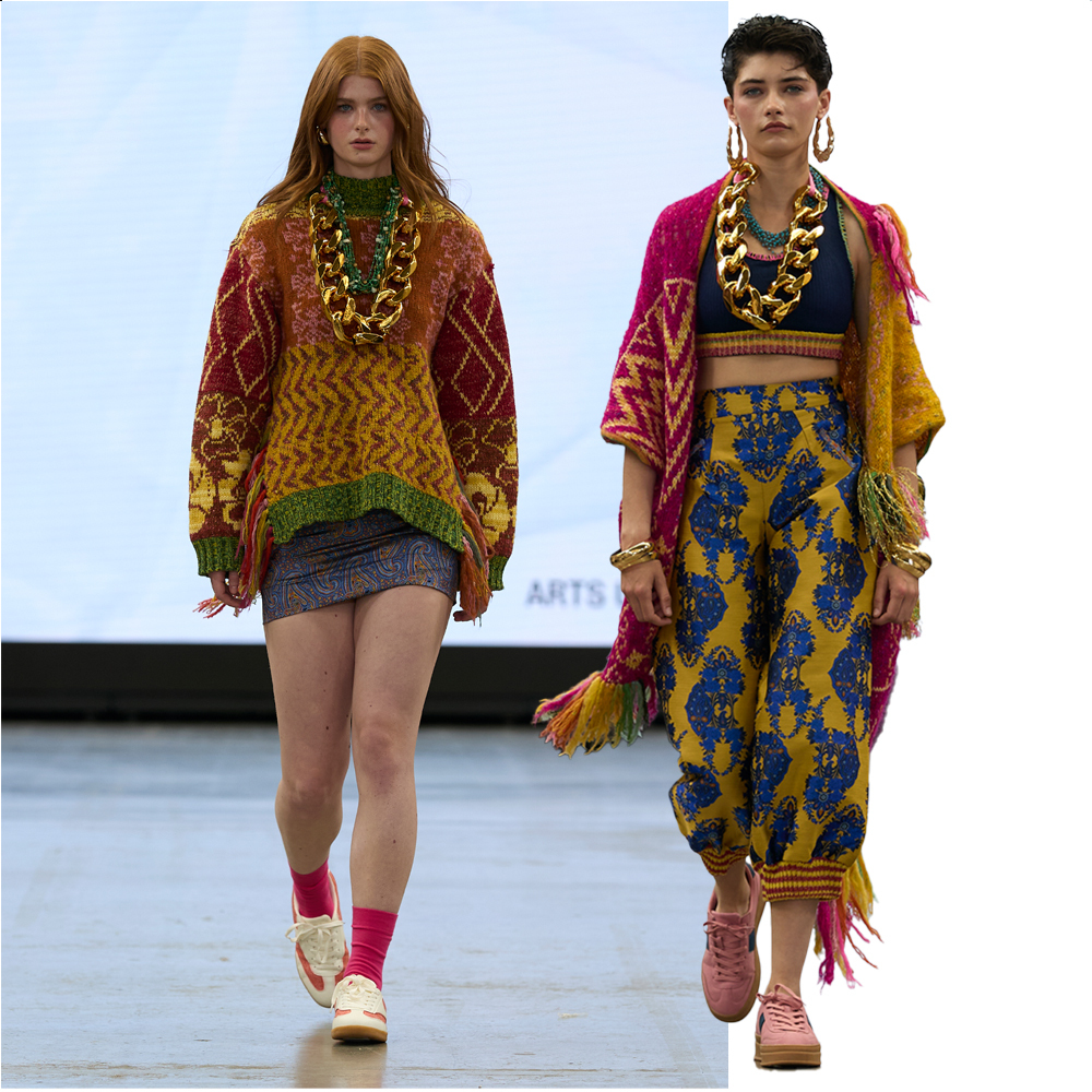 Two models walking on runway wearing colourful patterned garments with gold jewellery and red accessories against white background.