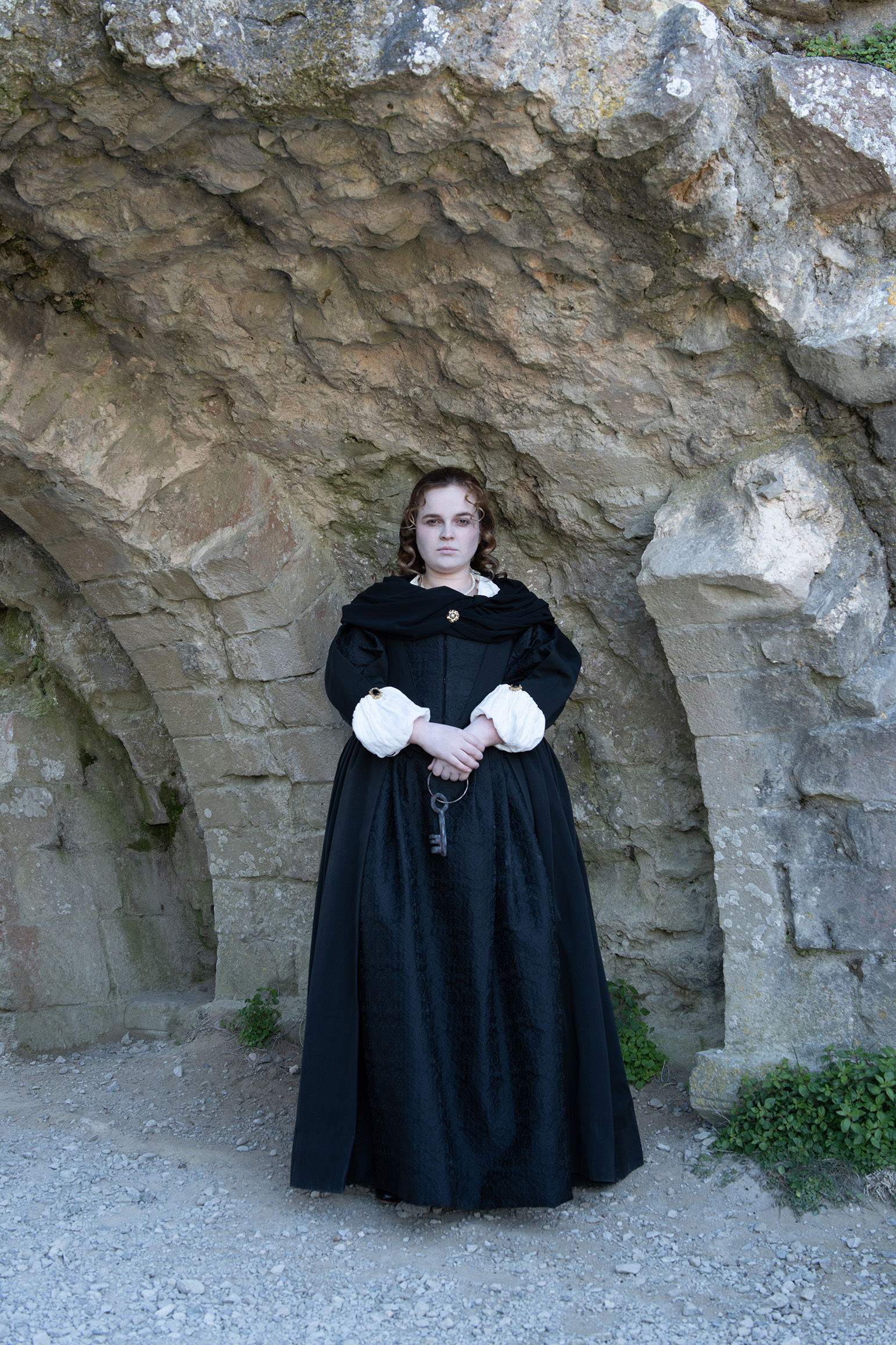 Actor playing Mary Bankes, posing at Corfe Castle as part of a collaboration between AUB alumna and the National Trust