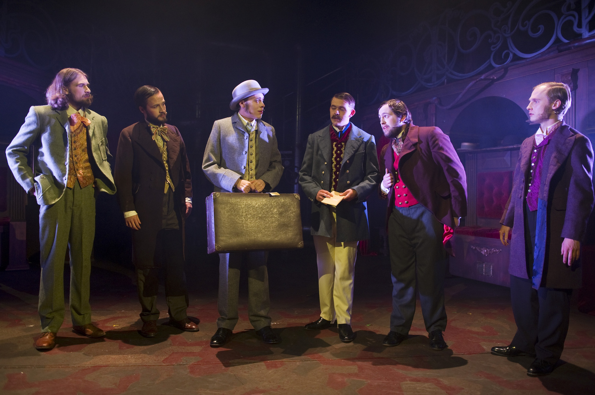 Six BA (Hons) Acting students dressed in period-style costume while performing AUB Productions' "Masque Macabre".
