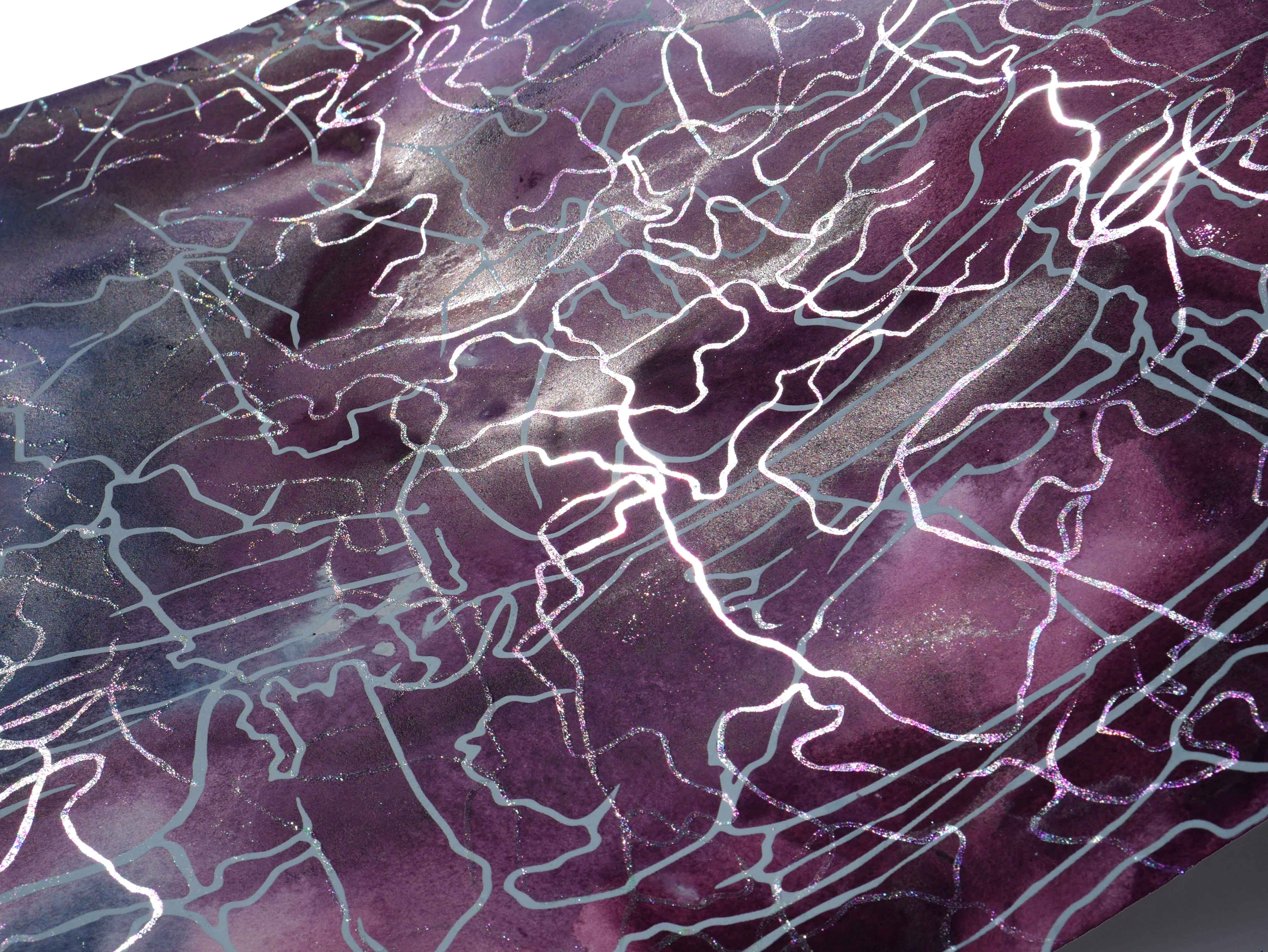 A close-up view of a textured surface featuring a purple background with intricate white patterns resembling abstract lines and shapes. The surface exhibits a shiny finish that reflects light, enhancing the visual complexity.