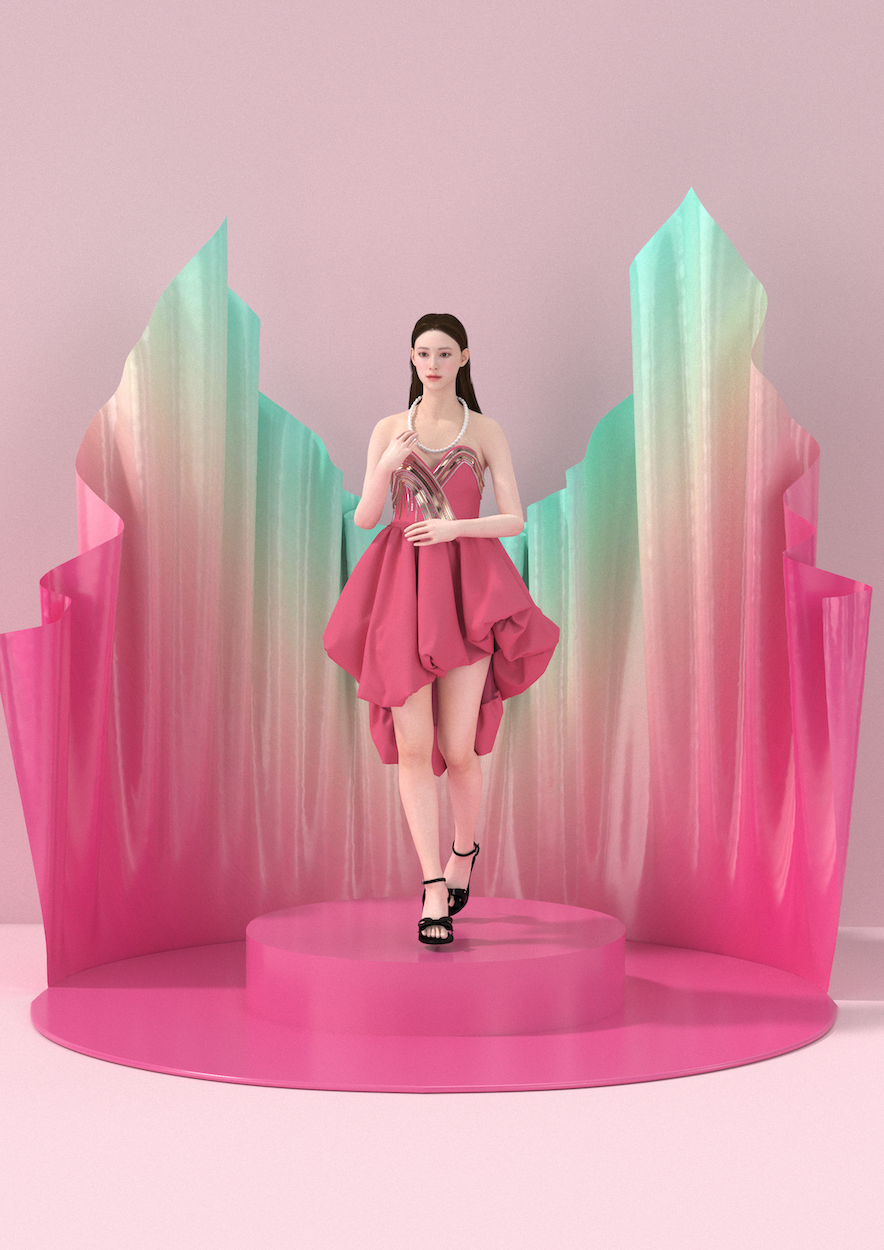 A digital model wearing a strapless pink dress, standing on a bright pink pedestal with rainbow-coloured billowing backdrop.