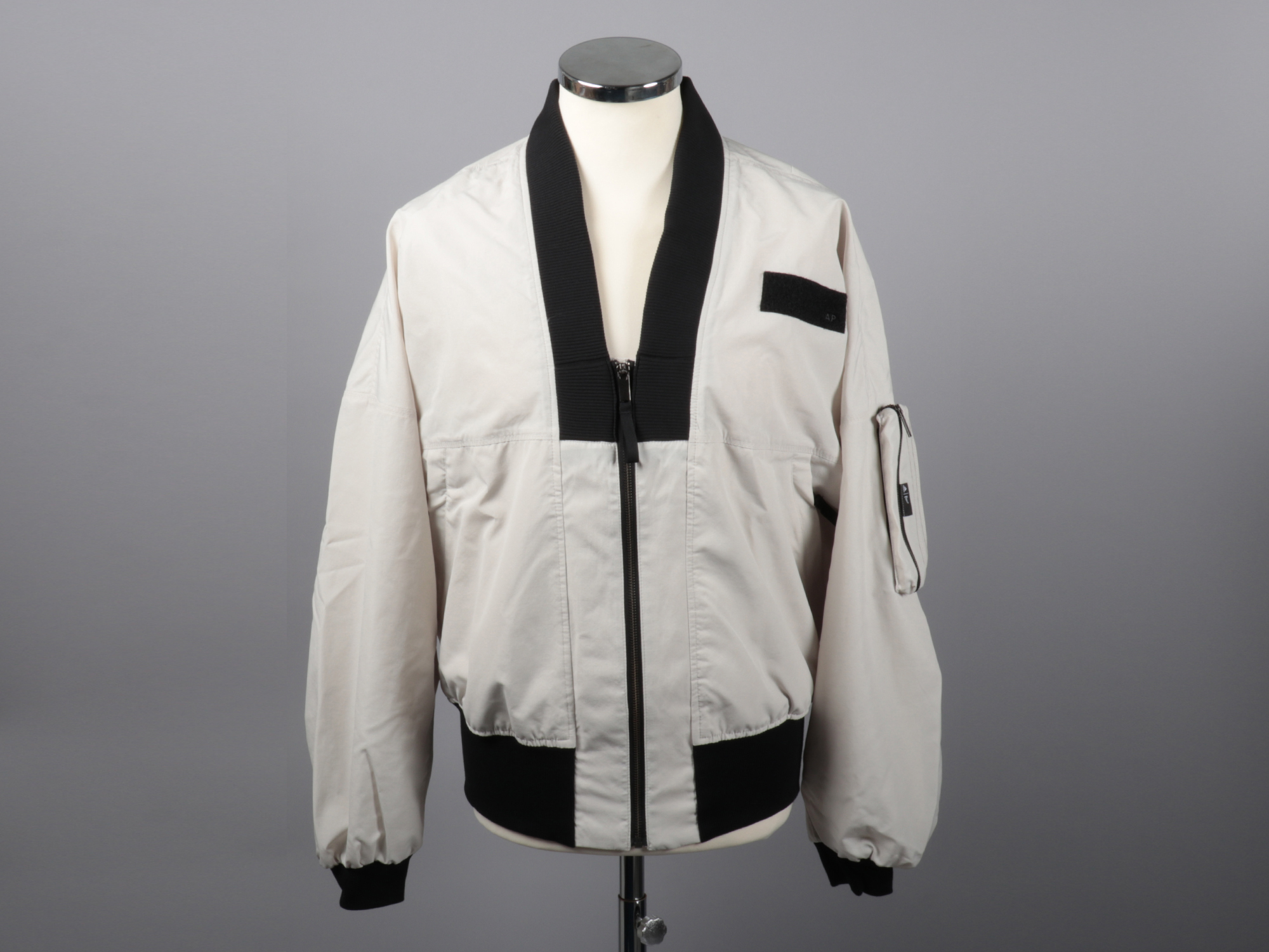 A bomber jacket on display on a mannequin.