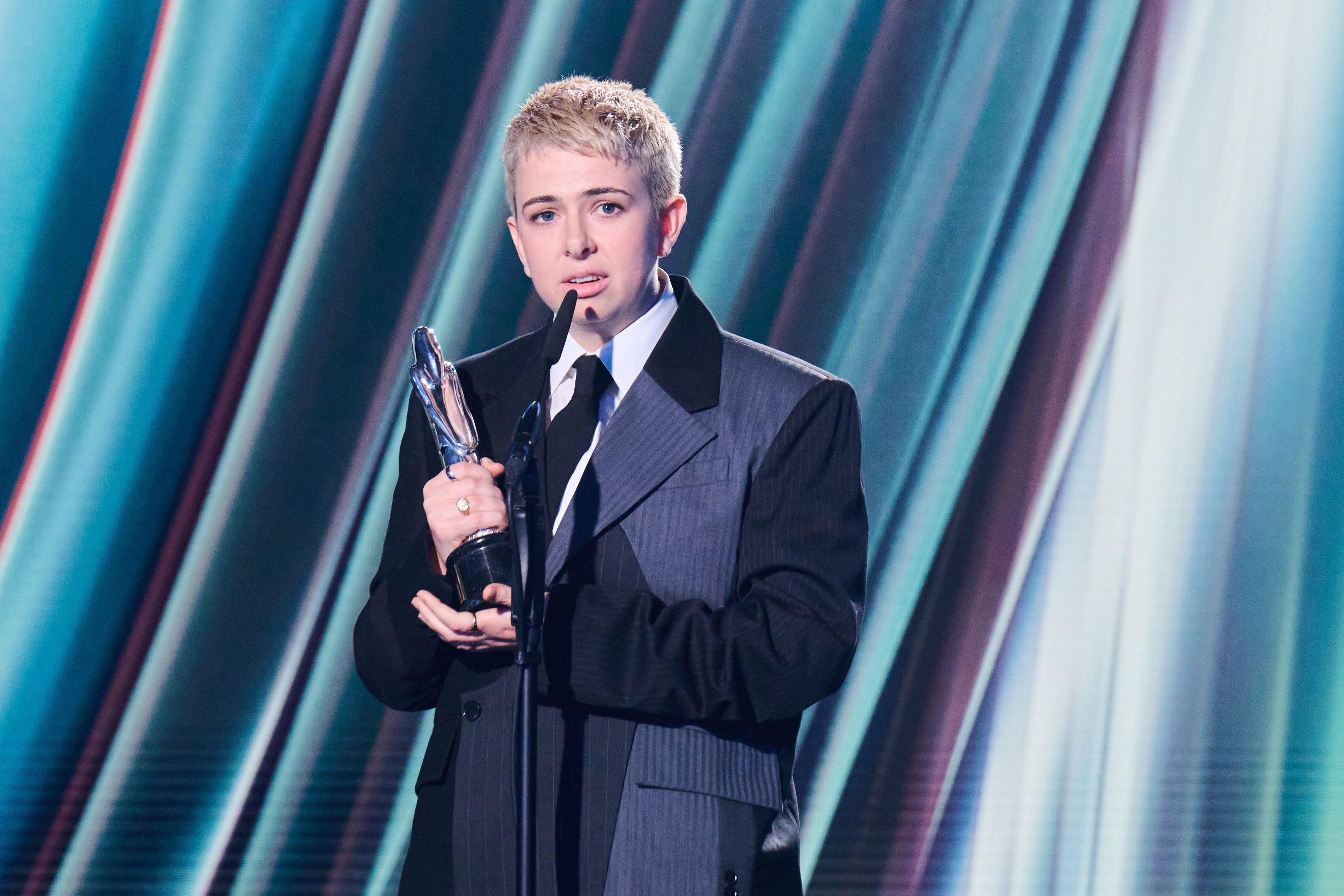 Filmmaker Molly Manning Walker collects an award