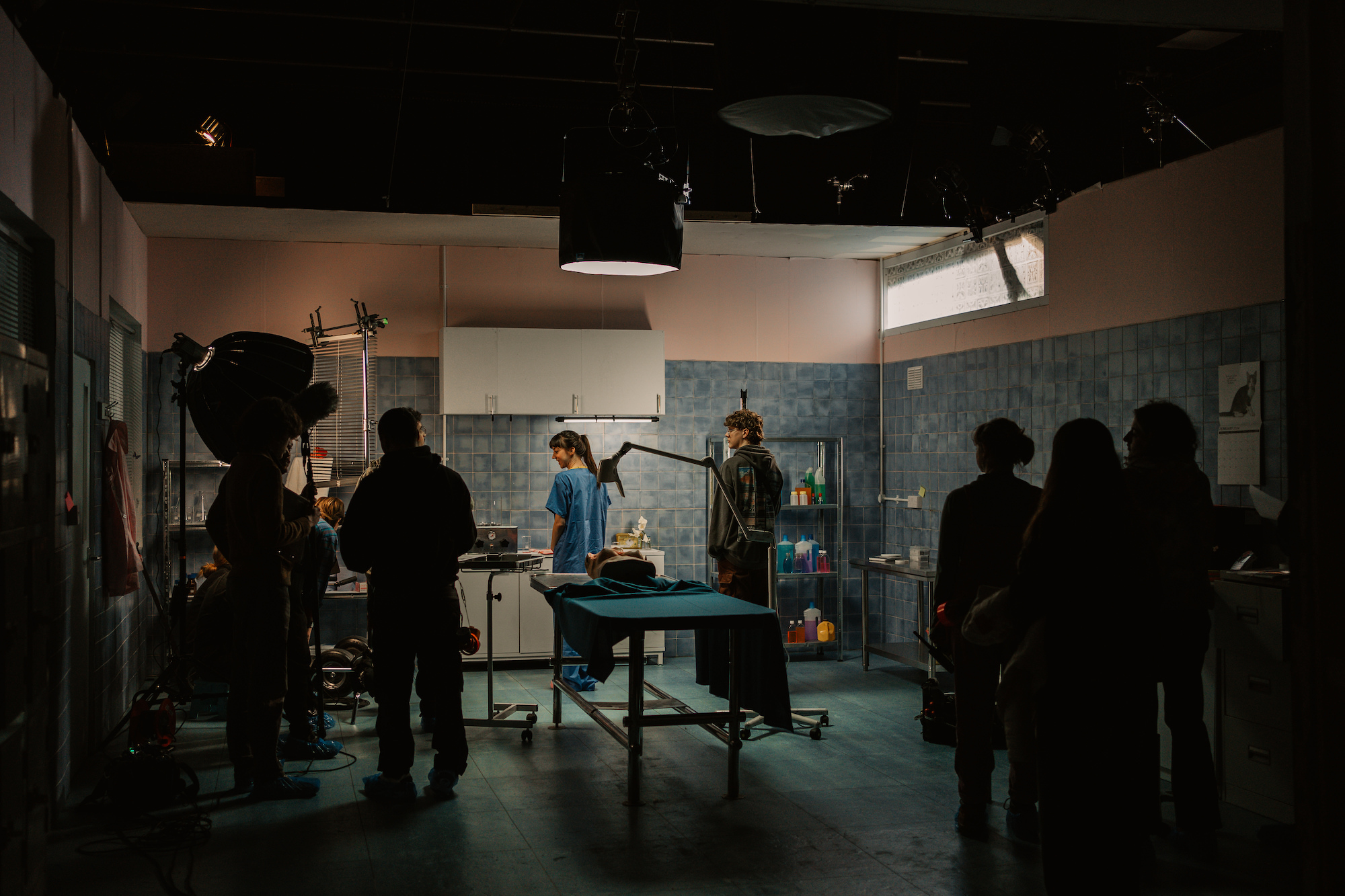 A cast and film crew shooting a scene taking place in a morgue from the film "Mourning Glories".