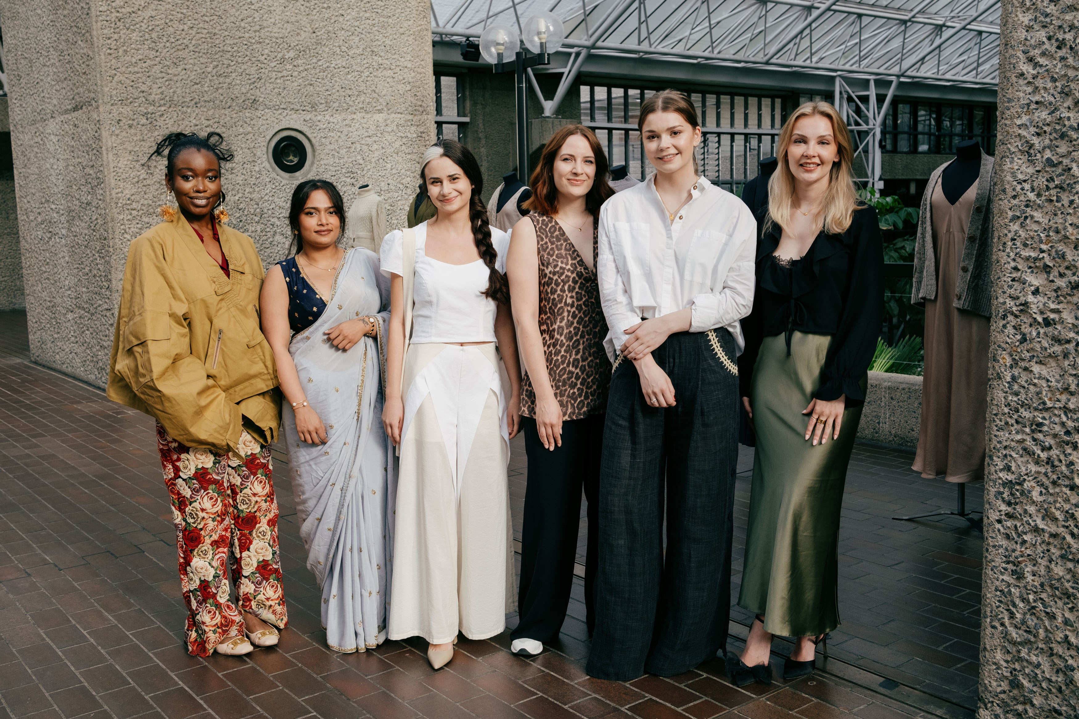 J Horton with five fellow fashion designers at the Net-a-Porter x King's Foundation Barbican launch event.