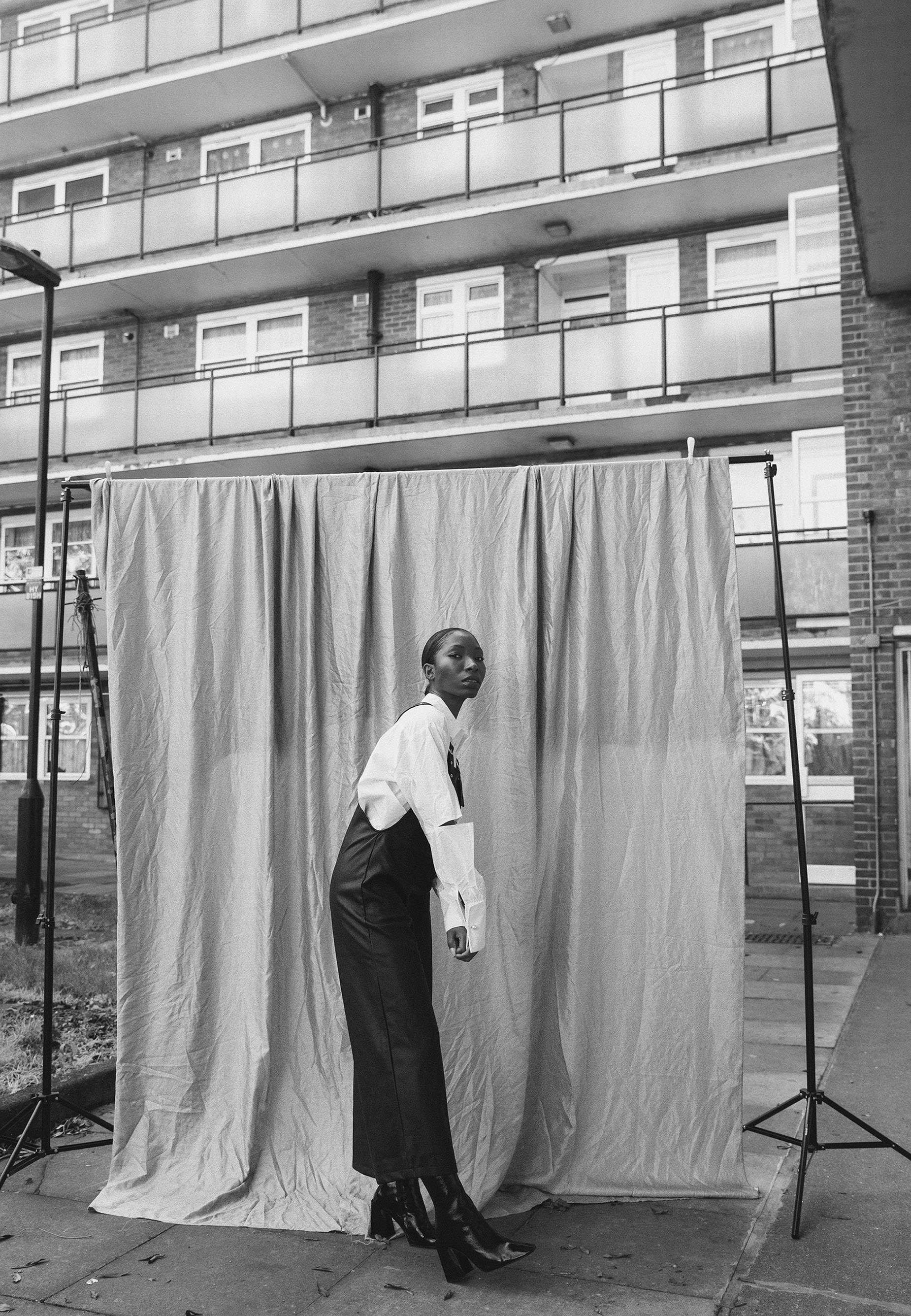 a woman stood in front of a sheet