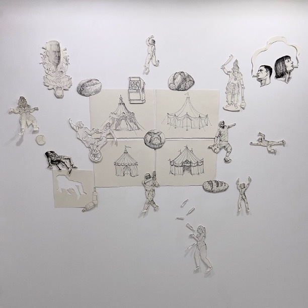 Pencil sketch with scattered figures, tents, and objects arranged across beige rectangular sections on white paper background.