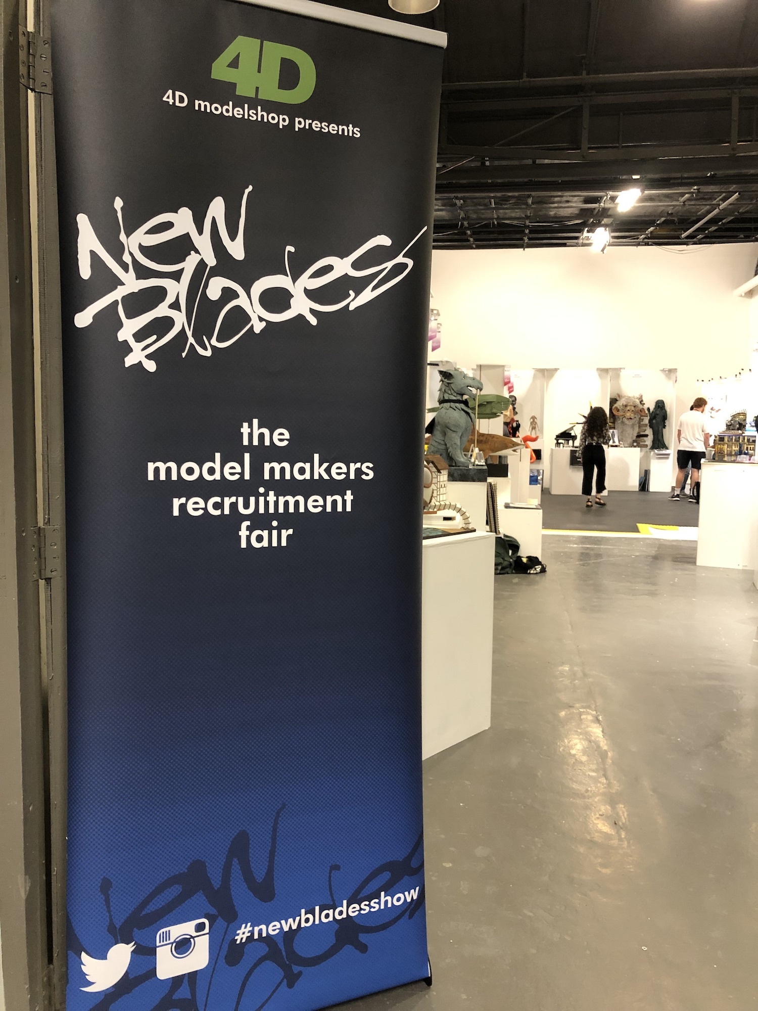 Banner with the New Blades logo hanging in the convention room.