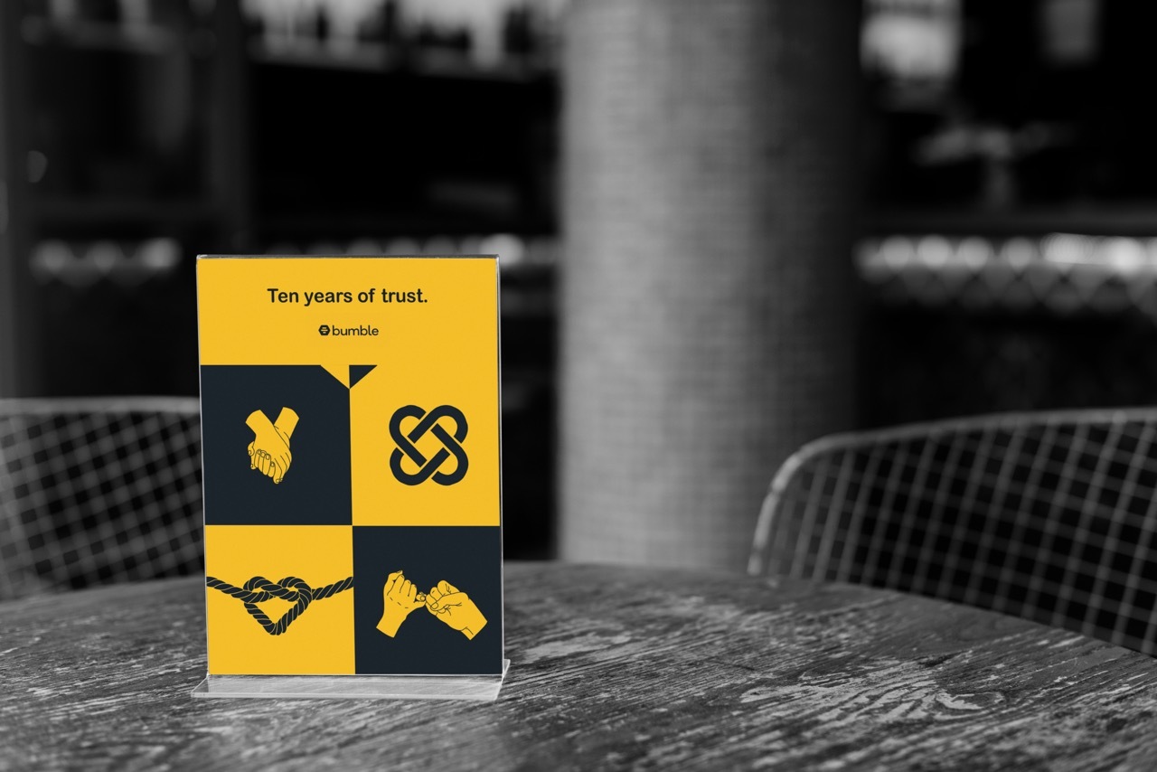 Coffee shop advertising branding for the ’10 Years of Trust’ campaign, yellow and black graphics.