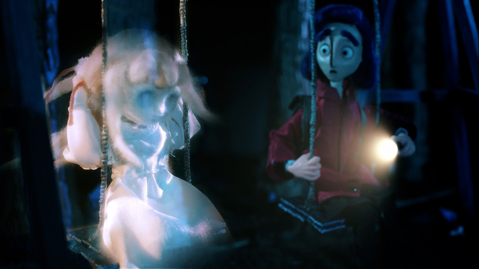 Animation still of a girl with a ghost girl on swings.