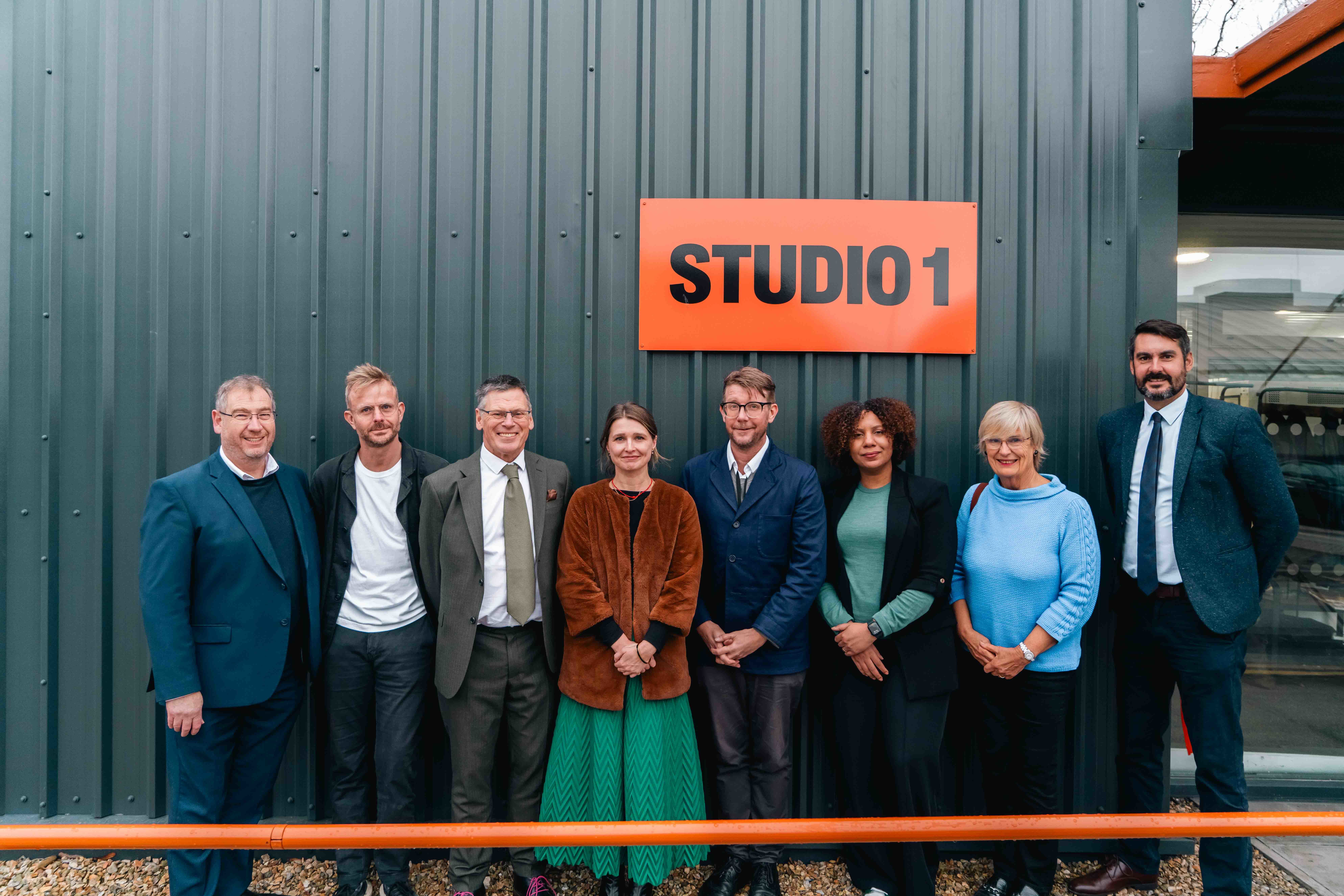 A group of AUB staff lined up outside the North Lights Studio on AUB Campus to pose for a photo.