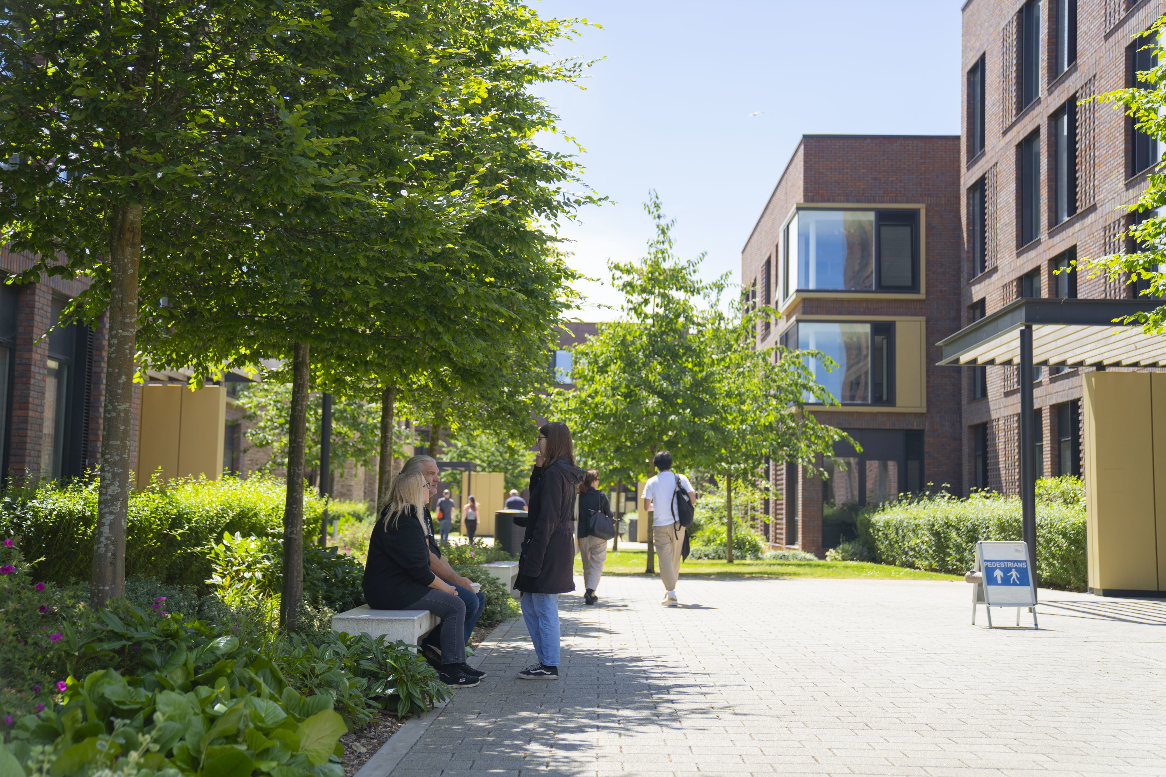 People walking through AUB Halls of Residence during a summer Open Day.