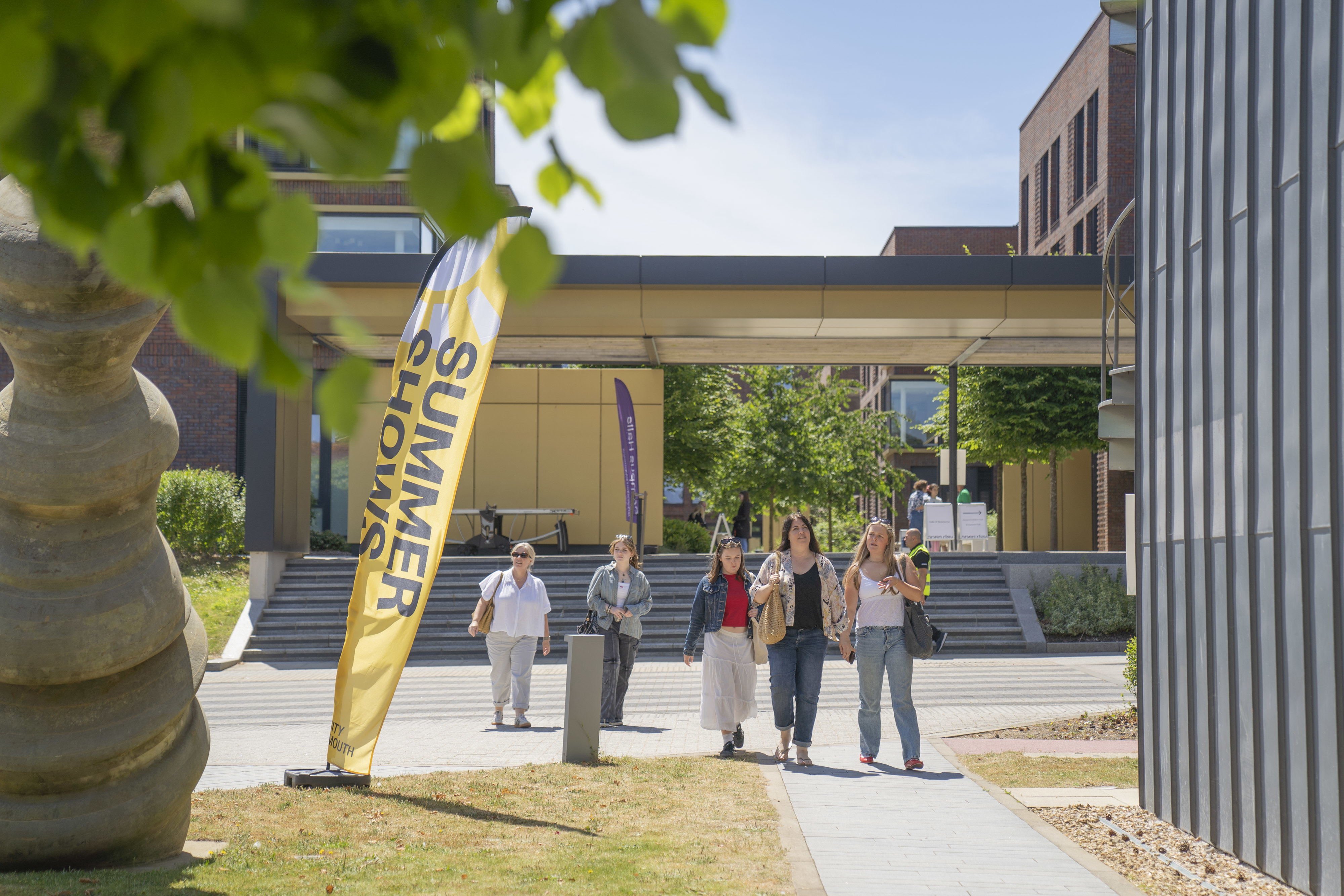 People walking from AUB Halls of Residence during Open Day in summer.