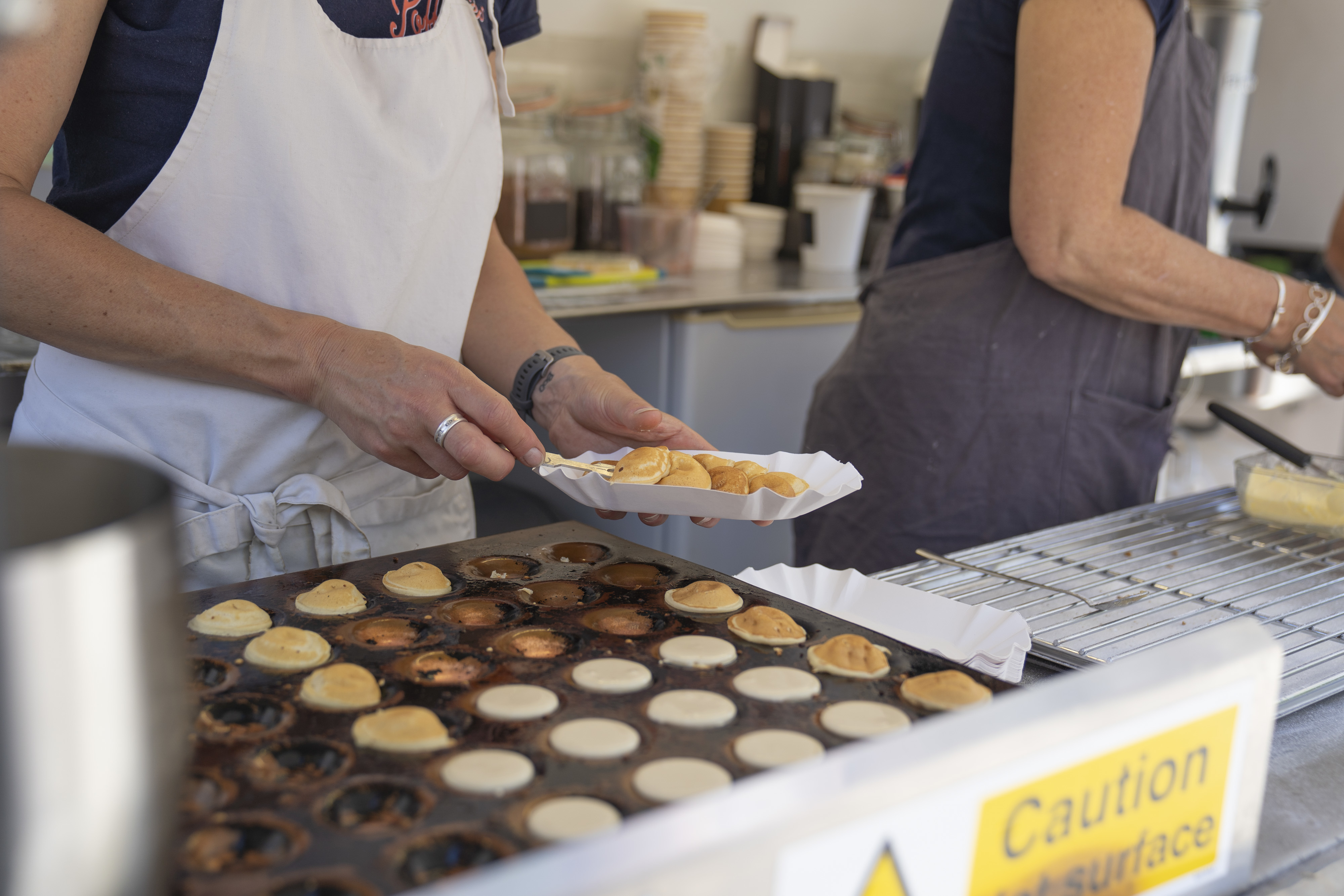 Mini Dutch pancakes being prepared at AUB Open Day.