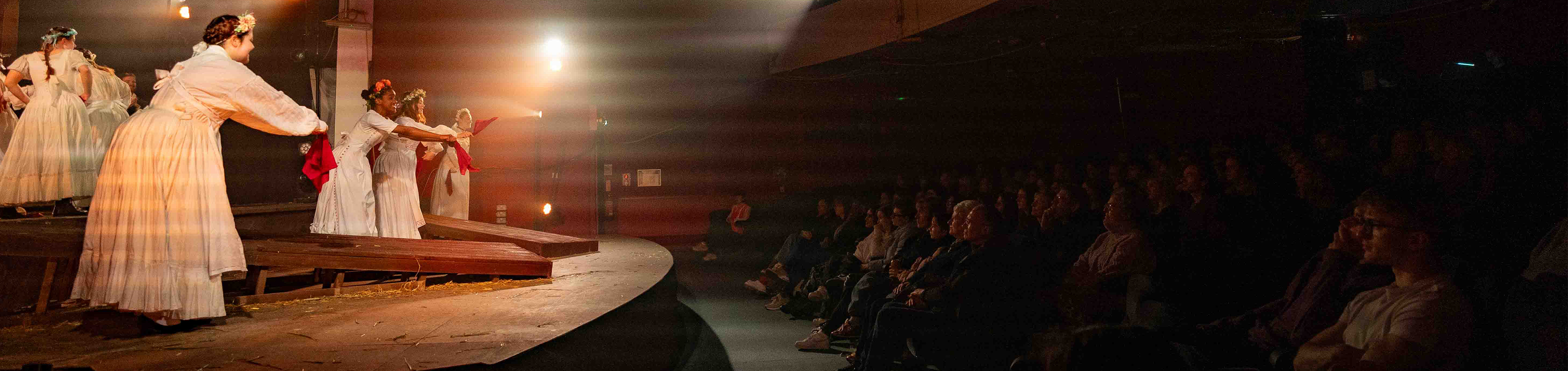 An audience watches as a group of BA (Hons) Acting students perform a production of "The Ballad of Maria Marten" at the Palace Court Theatre in Bournemouth.