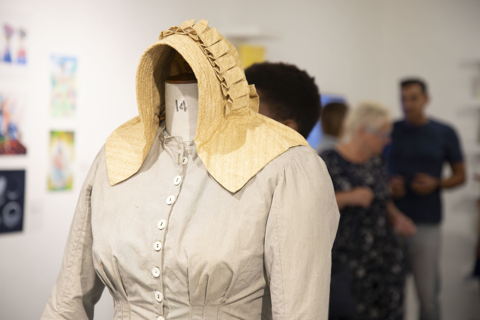 Close-up of a historical-style blouse and bonnet on a mannequin displayed as part of AUB's Postgraduate Summer Shows 2024.