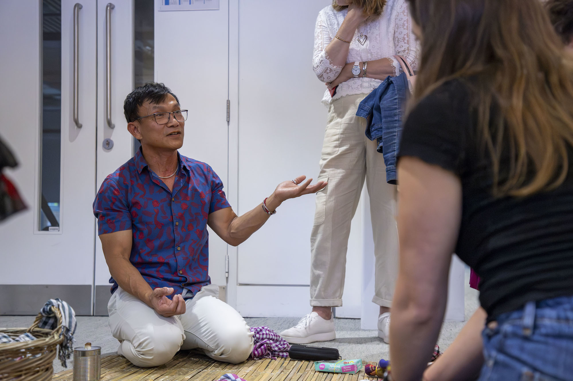 An AUB MA student explaining about their work during the 2024 Postgraduate Summer Shows.