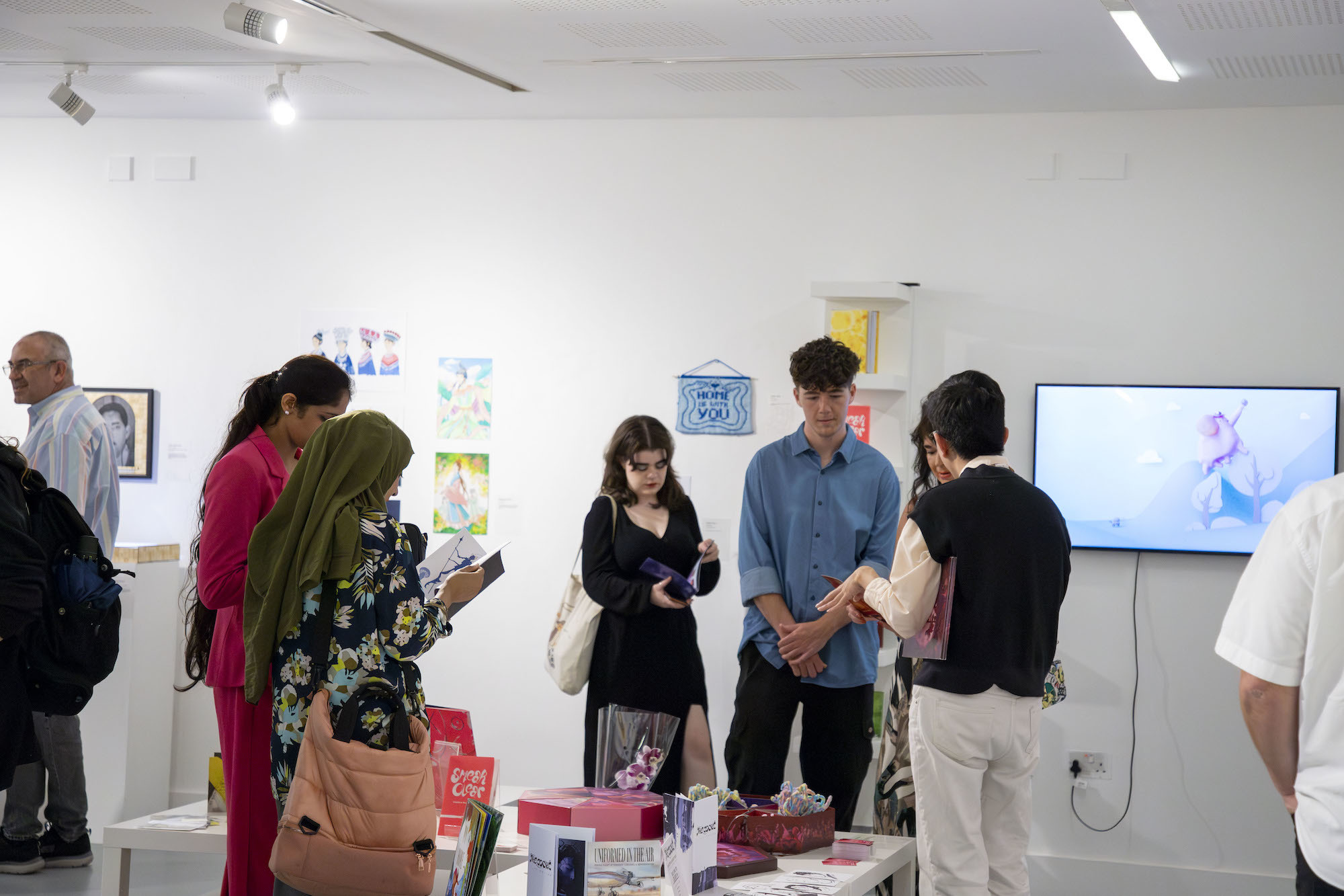 Several visitors of the 2024 Postgraduate Summer Shows on AUB Campus.