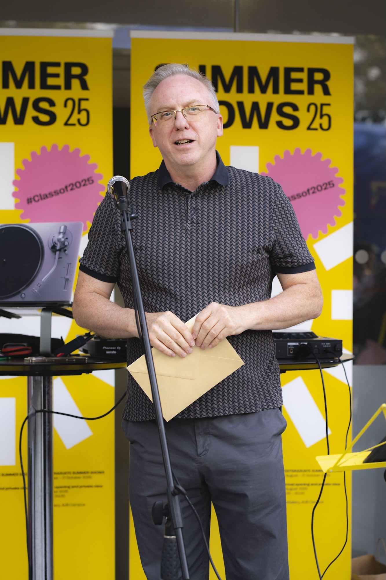 Professor P Wenham Clarke giving a speech at the 2025 Postgraduate Summer Shows at Arts University Bournemouth.