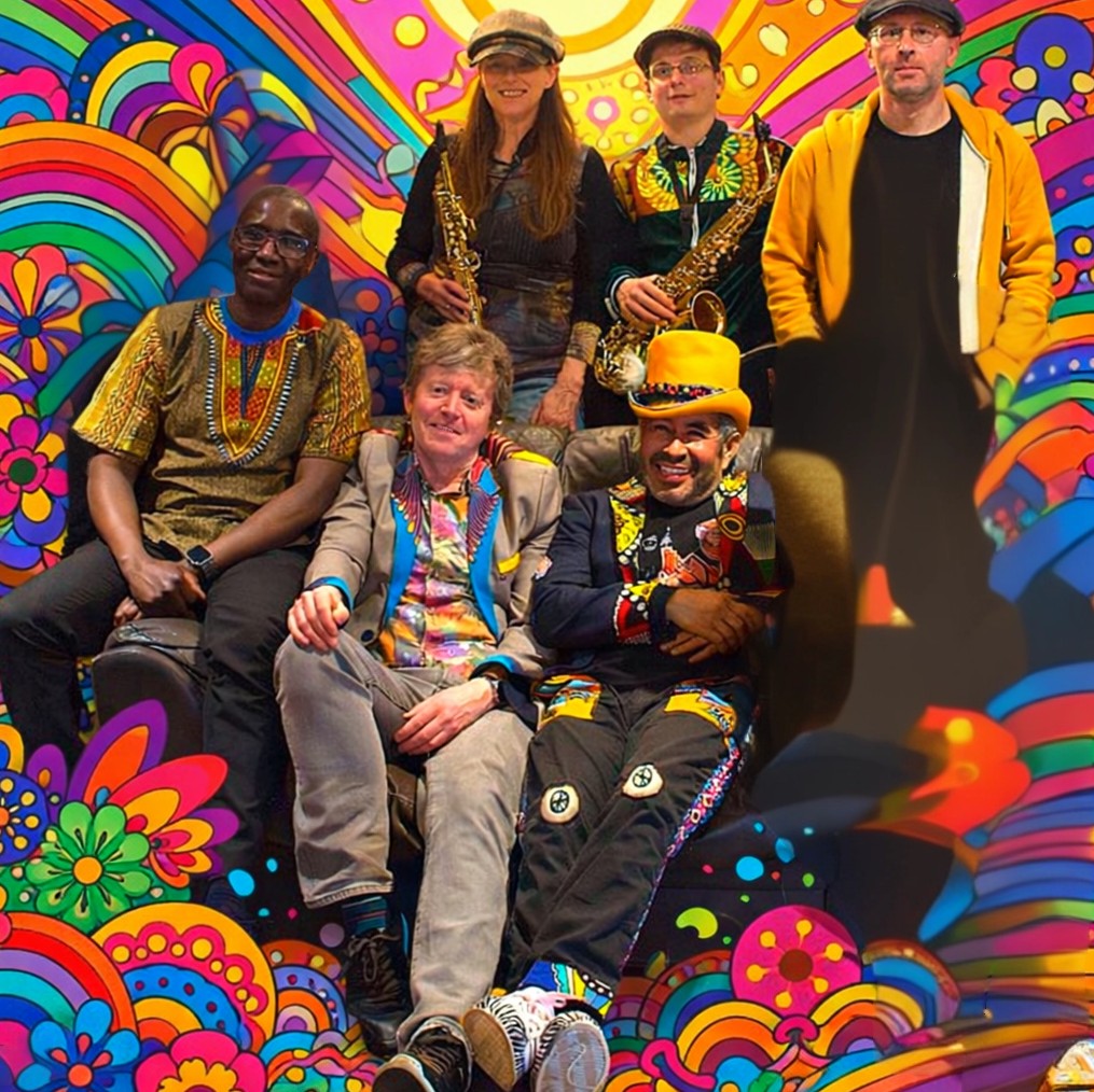 A group of six musicians in colourful clothing surrounded by vibrant abstract illustrations.