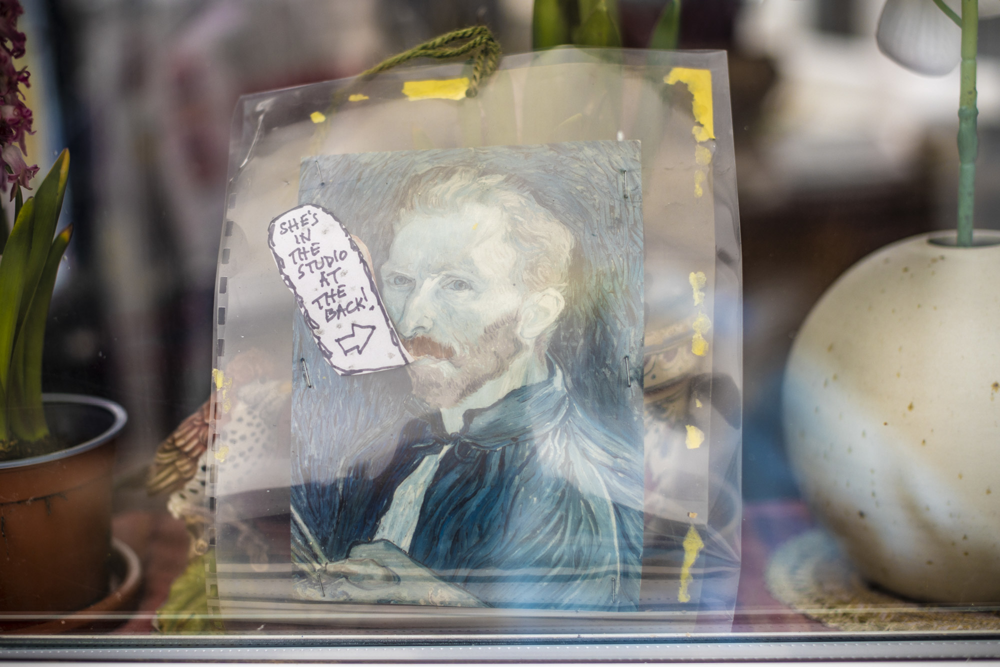 Vincent Van Gogh painting with funny speech box reading 'She's in the studio at the back!'.