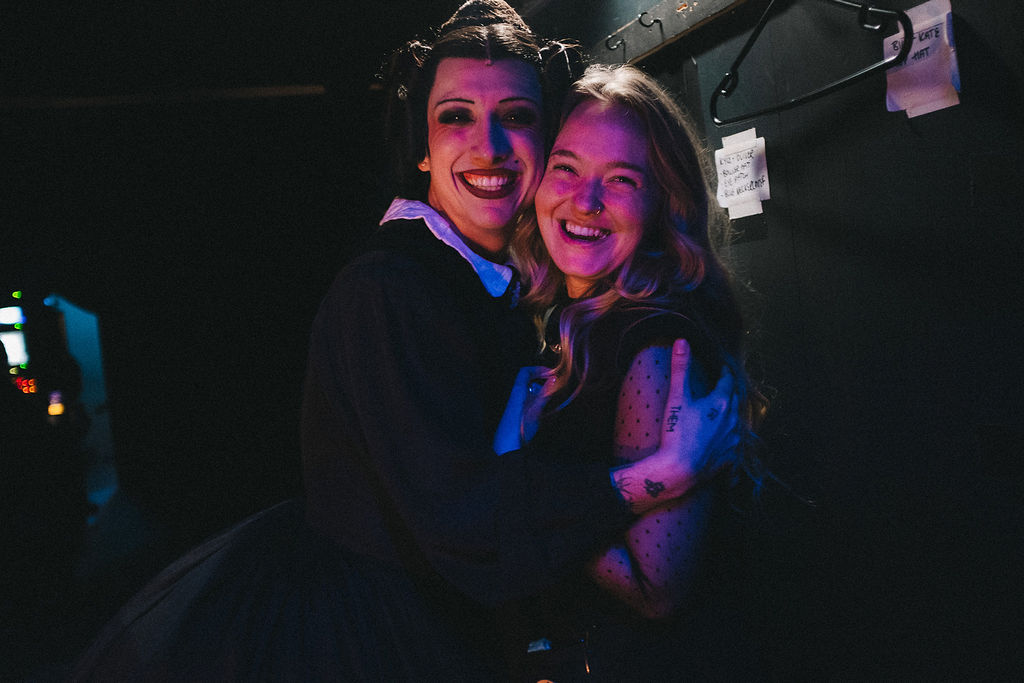 M A Park in costume as Mary Todd Lincoln and P Spear smiling and posing for a photo backstage on "Oh Mary!"