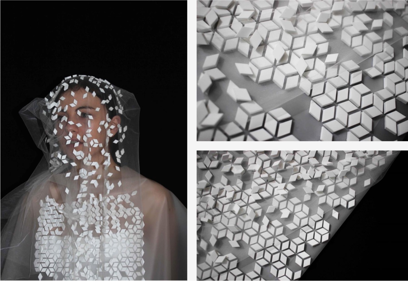 A veil worn by a model with geometric white features.