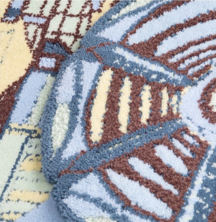A flowery blue, green and brown piece of textile work