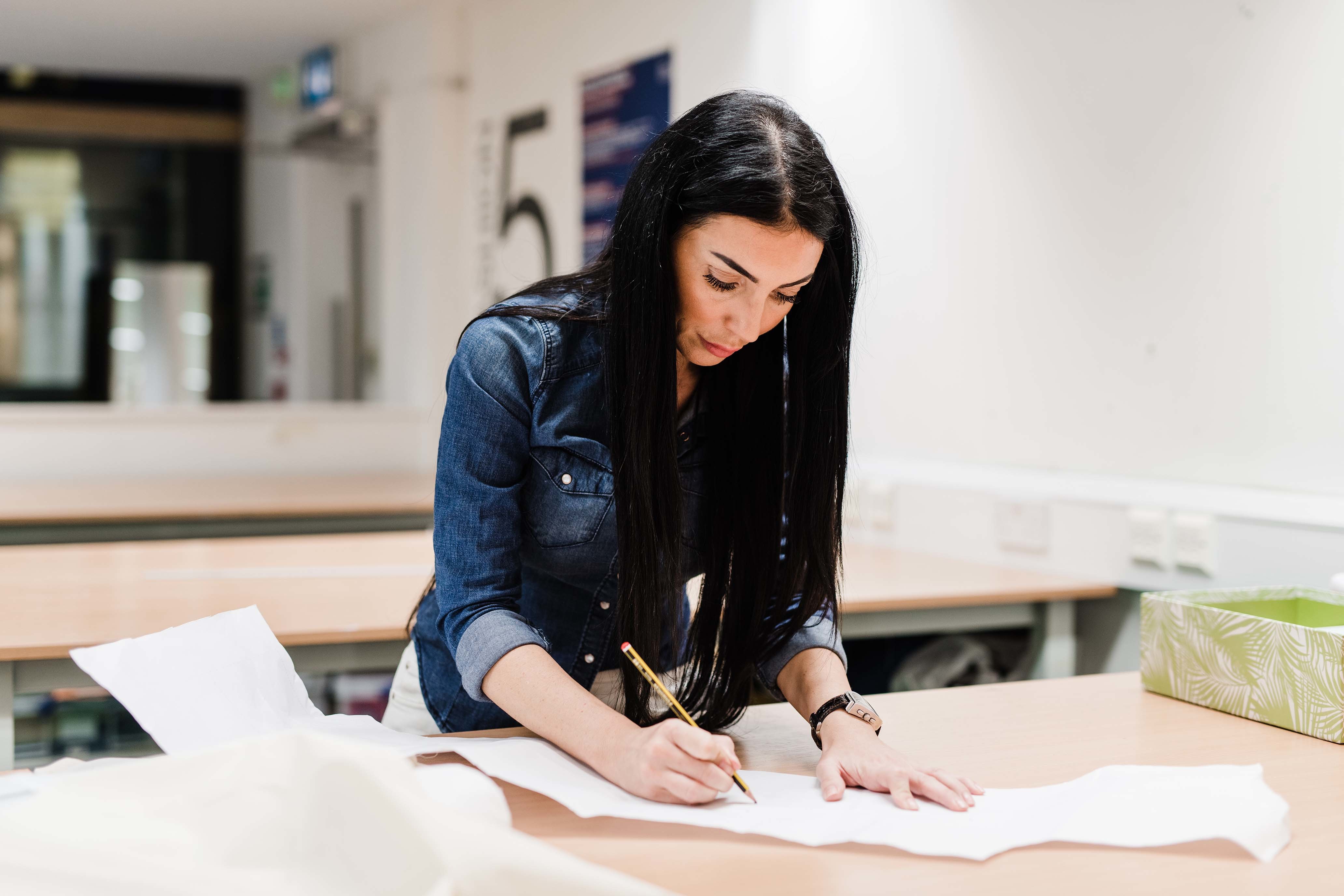 student in pattern cutting class