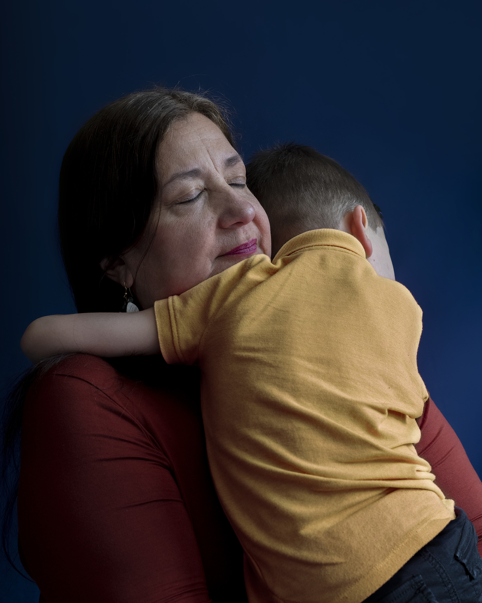 Pilar and a child embracing