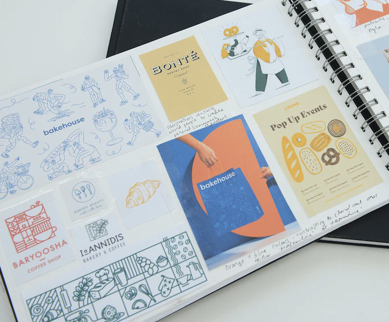 A sketchbook open to a page showing samples of branding for bakeries and coffee shops.