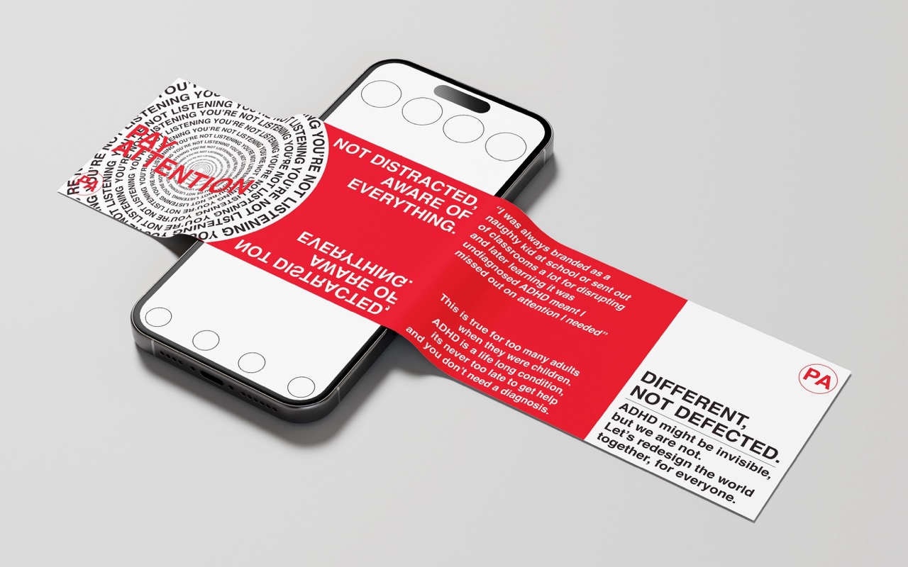 Mock-up carousel post over a phone like a piece of paper in red and white, text reads 'Pay attention, different. Not defected', white background.
