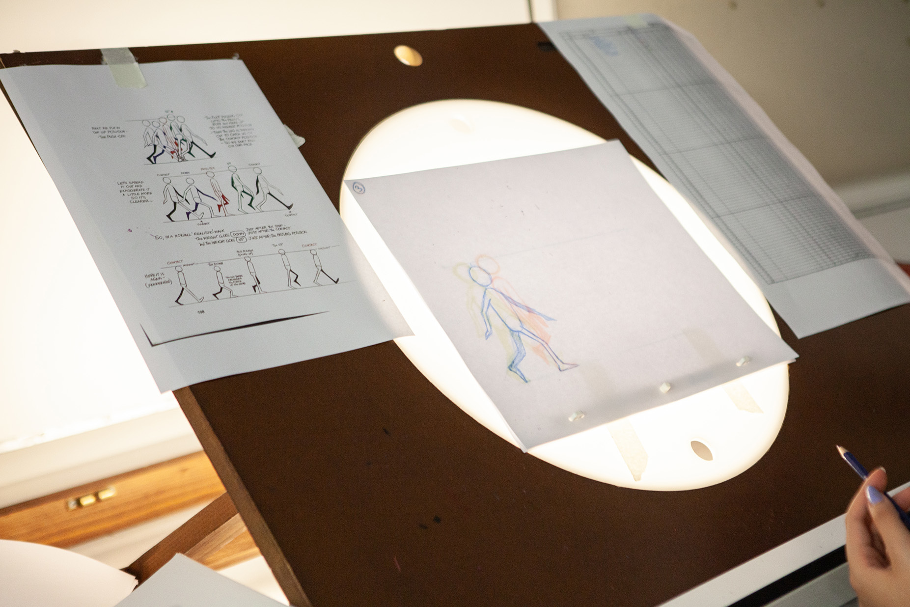 A drawing of a person sitting on a lightbox