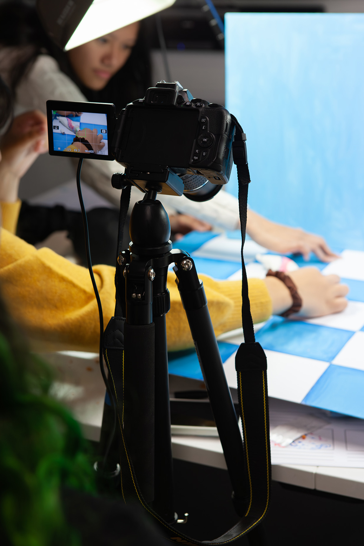 A camera is poised over a table to capture stop motion images