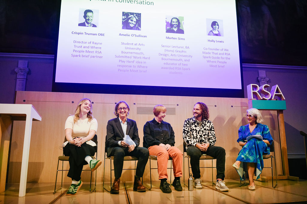 Five panellists including A. O'Sullivan seated on wooden chairs on stage beneath large projection screen showing speaker profiles. RSA logo visible on right.