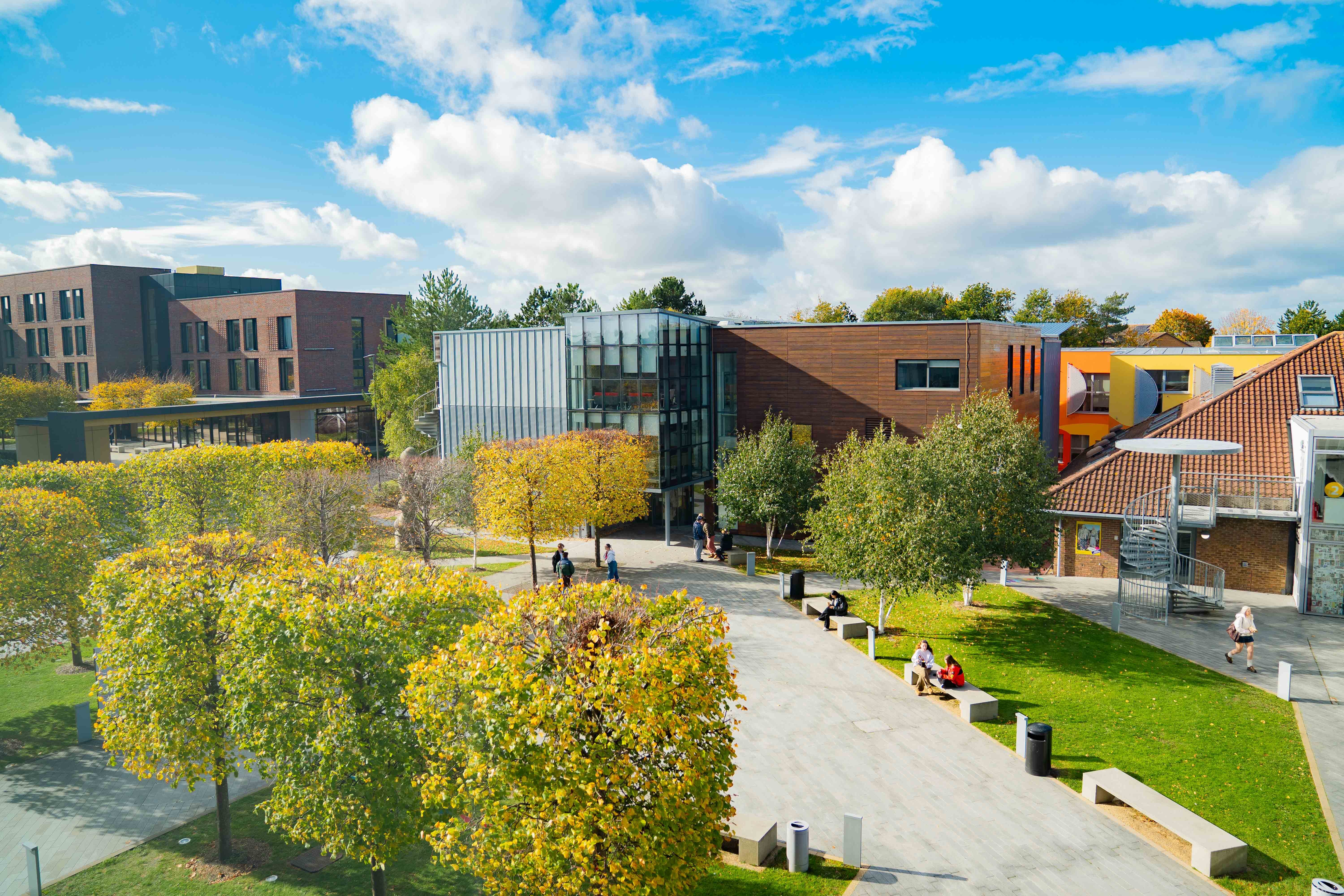 Courtyard on Arts University Bournemouth campus with University House, Campus Halls and the Innovation Studio visible in the background.