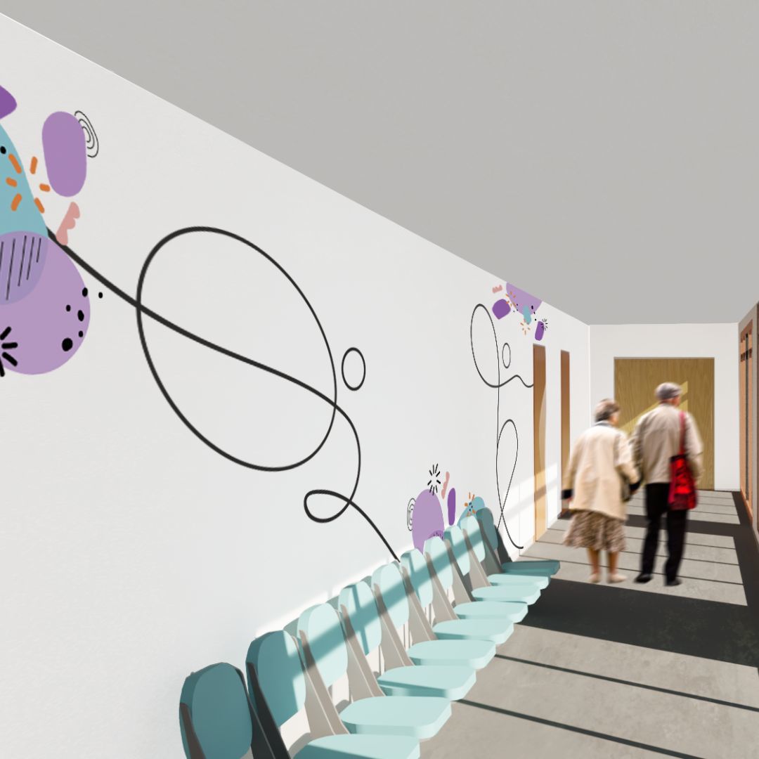 A hospital or clinic corridor with a row of seats along one wall, and two people walking down. The walls have an abstract blue and purple decorative design.