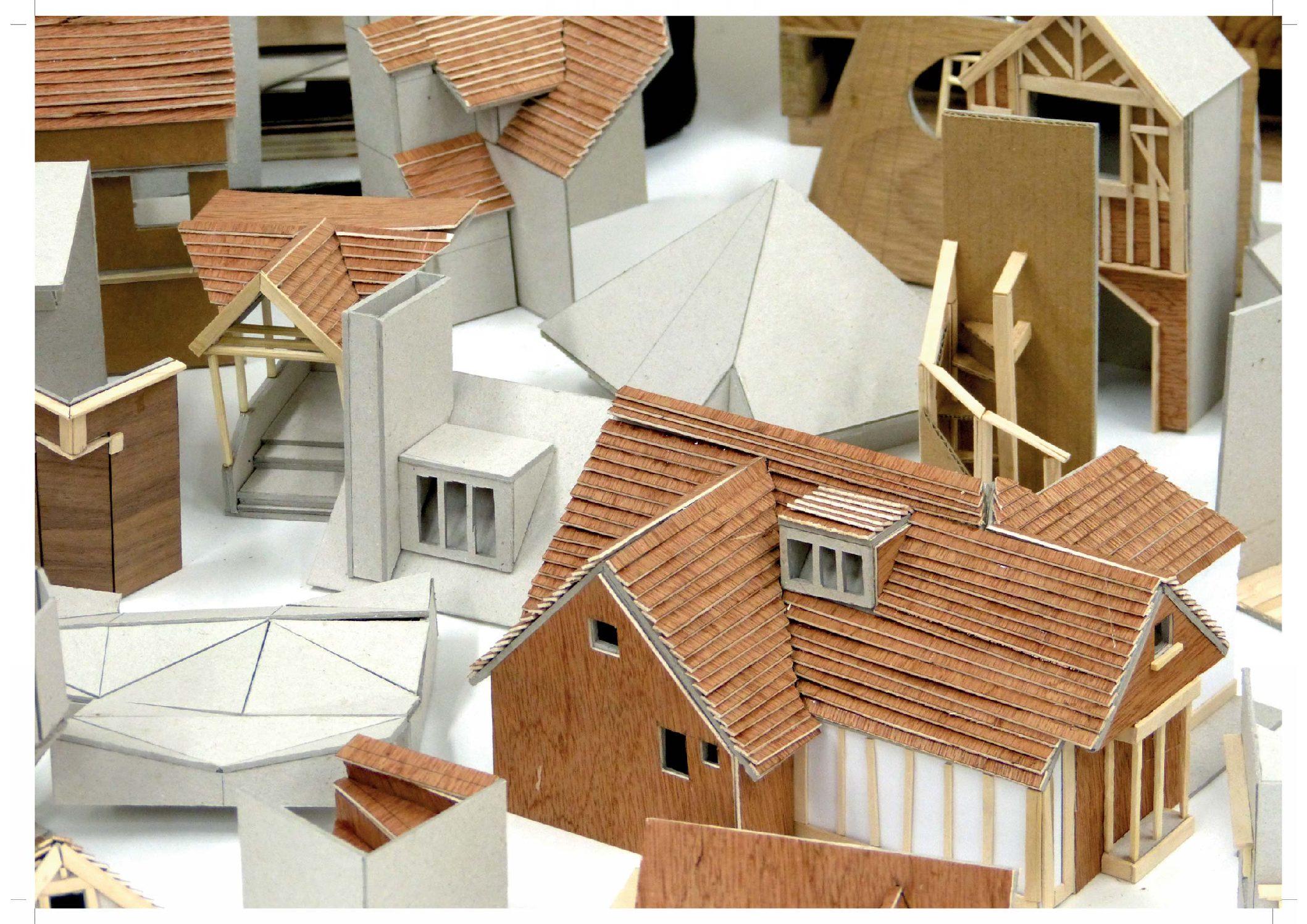 Small-scale models of architectural building roofing, red, wood-panelled, white.
