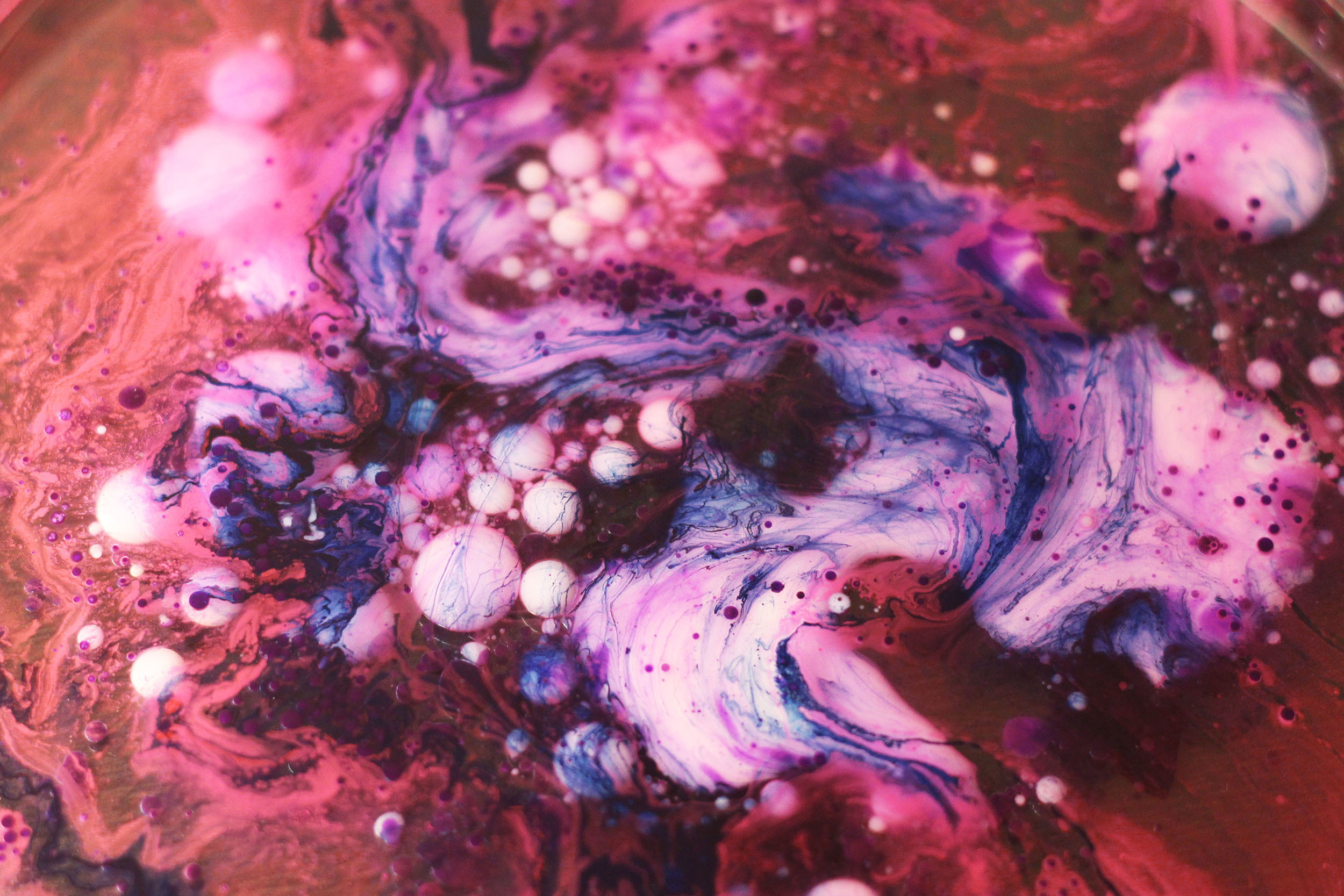 Pink and purple ink and bubbles