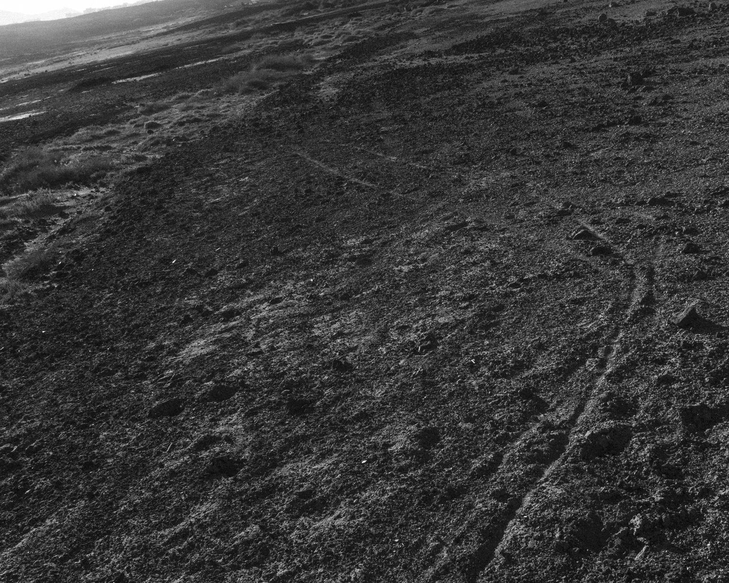 Black and white photograph of an earthy landscape