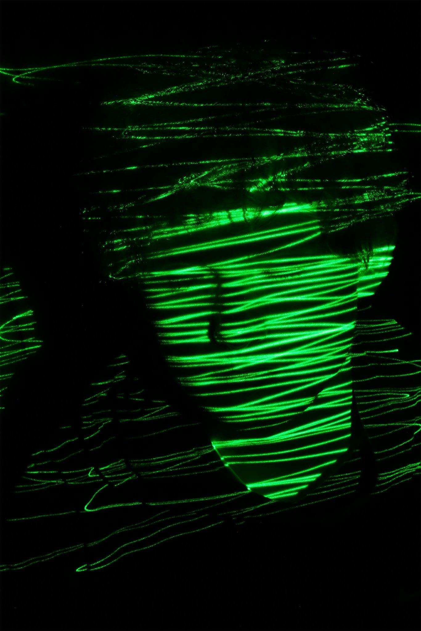 face in green light